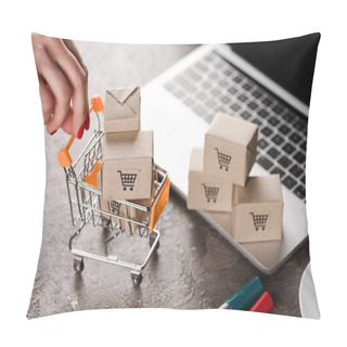 Personality  Cropped View Of Woman Holding Toy Shopping Cart With Small Boxes Near Laptop, E-commerce Concept Pillow Covers