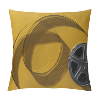Personality  Top View Of Movie Reel With Twisted Cinema Tape On Yellow Background Pillow Covers