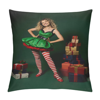 Personality  Pretty New Year Elf In Festive Dress With Arms Akimbo Posing With Presents On Green Backdrop Pillow Covers
