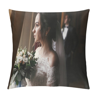 Personality  Gorgeous Bride In Amazing Dress With Bouquet And Stylish Groom Posing At Window In Luxury Room In Hotel. Rich Wedding Couple Looking At Light. Romantic Moment Of Newlyweds In Classic Indoors Pillow Covers