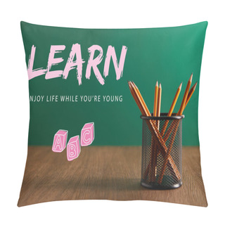 Personality  Pencils On Wooden Table With Green Chalkboard On Background With 