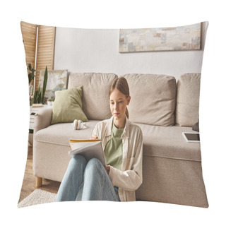 Personality  Pensive Teenage Girl Reading Her Notebook Near The Couch With Headphones And Digital Tablet Nearby Pillow Covers
