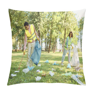 Personality  Socially Active Diverse Couple Wearing Safety Vests And Gloves Cleaning Up Trash In The Park With A Group Of People. Pillow Covers