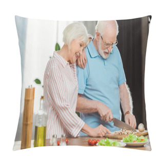 Personality  Smiling Senior Woman Standing By Husband Cutting Vegetables On Kitchen Table  Pillow Covers