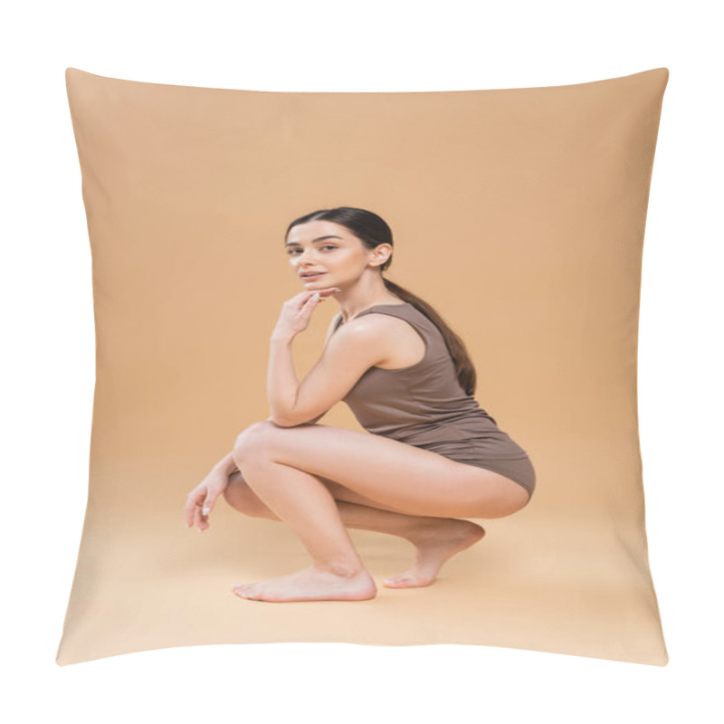 Personality  Full Length Of Brunette Barefoot Woman In Underwear Sitting On Haunches And Looking At Camera On Beige Background Pillow Covers