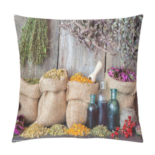 Personality  Healing Herbs In Hessian Bags And Bottles Of Essential Oil Near Pillow Covers