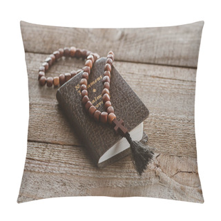 Personality  Close-up Shot Of New Testament Book With Beads On Wooden Table Pillow Covers