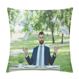 Personality  Young Businessman Sitting In Park Behind Table And Meditating Near Flying Papers Pillow Covers