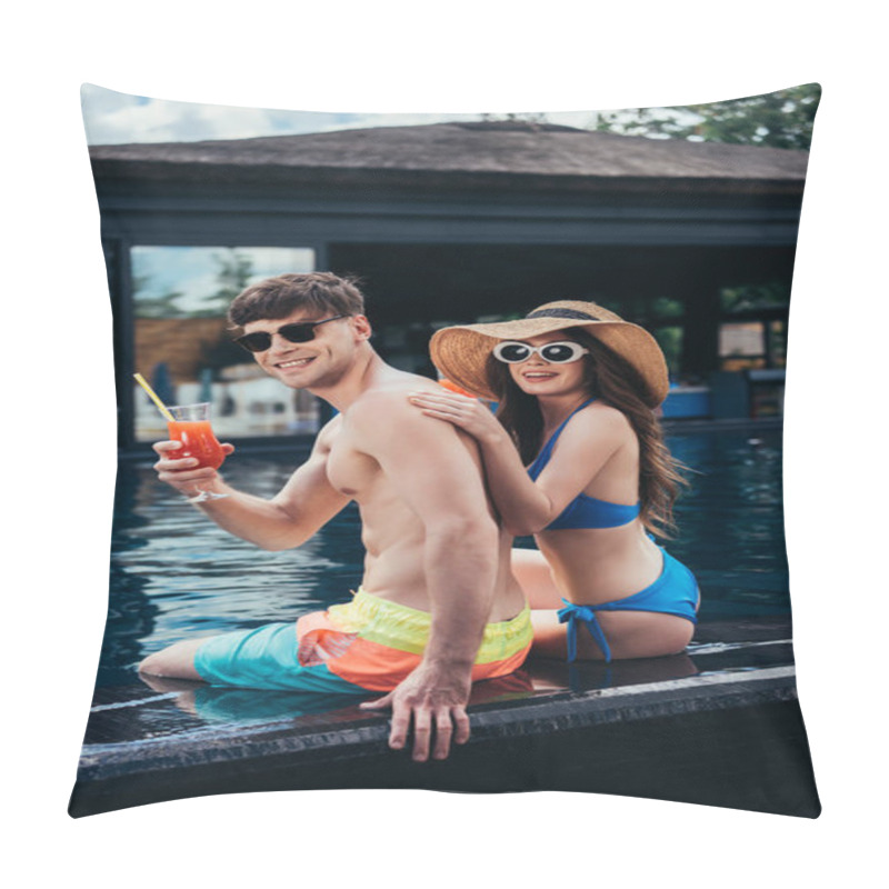Personality  Happy Young Couple Smiling And Looking At Camera While Sitting On Poolside Pillow Covers