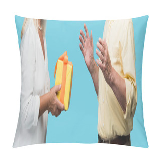 Personality  Panoramic Shot Of Retired Woman Giving Yellow Gift Box To Senior Husband Isolated On Blue  Pillow Covers