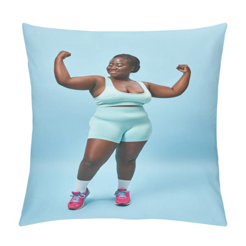 Personality  Cheerful Plus Size Woman In Active Wear Flexing Her Muscles And Smiling On Blue Background Pillow Covers