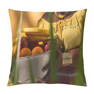 Personality  Cropped View Of Middle Aged African American Woman In Yellow Blouse Holding Metal Bowl With Fruits On Orange Pillow Covers