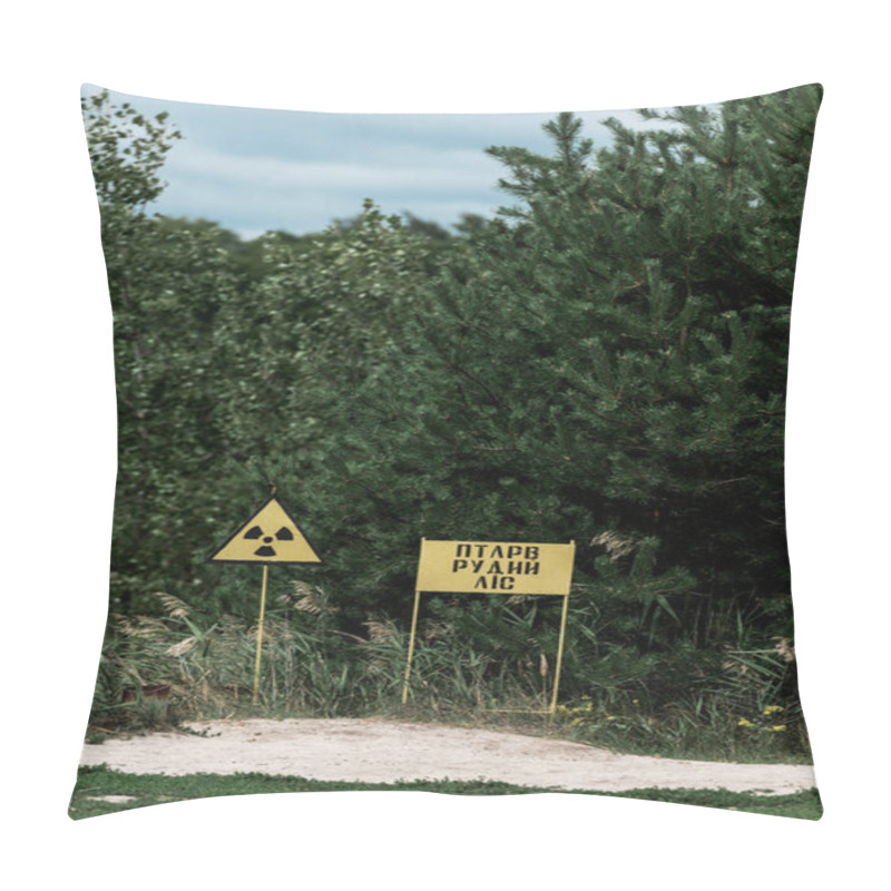 Personality  PRIPYAT, UKRAINE - AUGUST 15, 2019: chernobyl zone with yellow warning signs near green trees  pillow covers