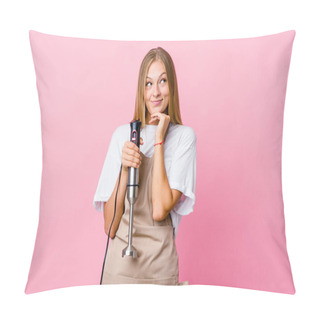 Personality  Young Russian Cook Woman Holding An Electric Mixer Isolated Keeps Hands Under Chin, Is Looking Happily Aside. Pillow Covers