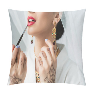Personality  Cropped View Of Indian Bride Applying Lipstick With Cosmetic Brush On White Pillow Covers