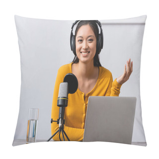 Personality  Excited Asian Radio Host In Wireless Headphones Looking At Camera While Sitting Near Microphone And Laptop Pillow Covers