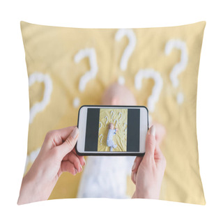 Personality  Cropped Shot Of Mother Taking Top View Photo Of Child Sleeping Surrounded With Question Marks On Yellow Bed Pillow Covers