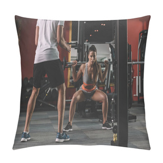 Personality  Cropped View Of Personal Trainer Looking At Young Sportswoman Lifting Barbell Pillow Covers