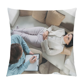 Personality  Overhead View Of Psychotherapist Writing On Clipboard And Upset Young Patient Lying On Couch Pillow Covers