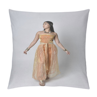 Personality  Full Length Portrait Of Pretty Young Asian Woman Wearing Golden Arabian Robes Like A Genie, Standing Pose  With Back To The Camera, Isolated On Studio Background. Pillow Covers