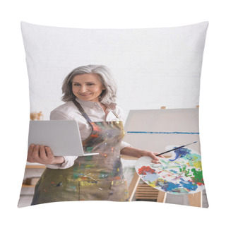 Personality  Smiling Mature Woman Holding Palette And Laptop While Watching Tutorial Near Canvas Pillow Covers