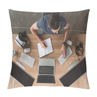 Personality  Overhead View Of Young Programmer Taking Notes In Notebook And Using Computers At Workplace Pillow Covers