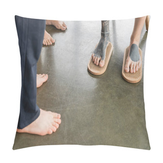 Personality  Cropped View Of Tattooed Man Standing With Bare Feet On Sadhu Nail Board Near Faceless People In Yoga Studio Pillow Covers