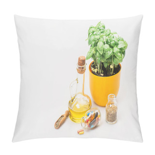 Personality  Green Plant In Flowerpot Near Pills And Herbs In Glass Bottles And Essential Oil On White Background, Naturopathy Concept Pillow Covers