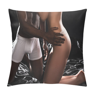 Personality  Cropped View Of Multiethnic Seductive Couple Hugging On Bed In Dark Pillow Covers