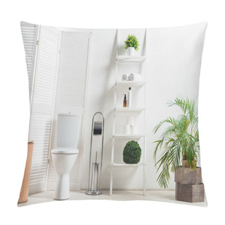 Personality  Interior Of White Modern Bathroom With Toilet Bowl Near Folding Screen, Laundry Basket, Rack And Plants Pillow Covers