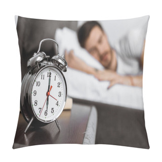Personality  Close-up View Of Alarm Clock And Young Man Sleeping Behind Pillow Covers