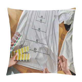 Personality  Top View Of Young Multiethnic Designers Holding Printing Layers And Color Swatches While Working Near Clothes With Markup On Table In Print Studio, Thriving Small Enterprise Concept Pillow Covers