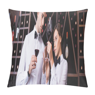 Personality  Panoramic Shot Of Sommelier Looking At Glass Of Wine Near Colleague In Restaurant  Pillow Covers