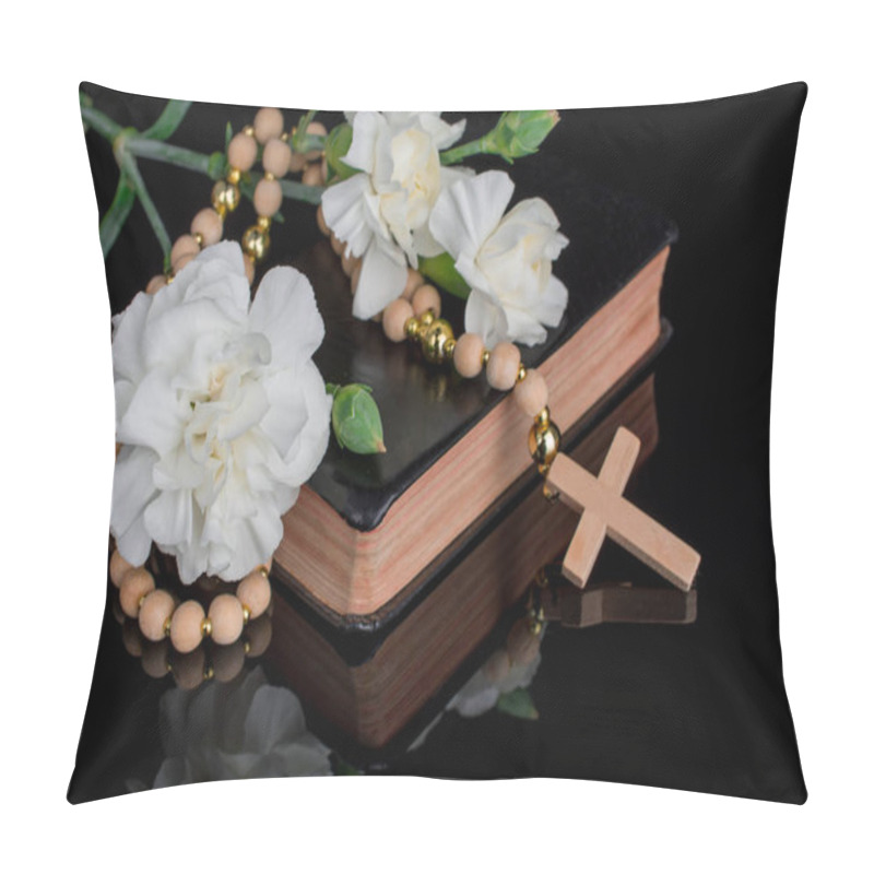 Personality  Closeup of wooden Christian cross prayer rosery beads and flower pillow covers