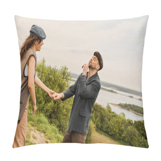 Personality  Fashionable Man In Newsboy Cap And Jacket Showing Secret Gesture And Holding Hand Of Cheerful Girlfriend While Standing With Nature At Background, Fashion-forwards In Countryside Pillow Covers