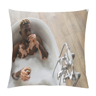Personality  Top View Of Young African American Man With Vitiligo Smoking Cigar And Holding Glass Of Bourbon In Bath With Foam  Pillow Covers
