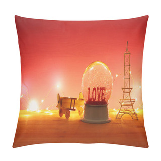 Personality  Valentine's Day Background. Water Globe With Word LOVE And Glitter Next Eiffel Tower, Wooden Toy Plane, Over The Table And Red Bakground Pillow Covers