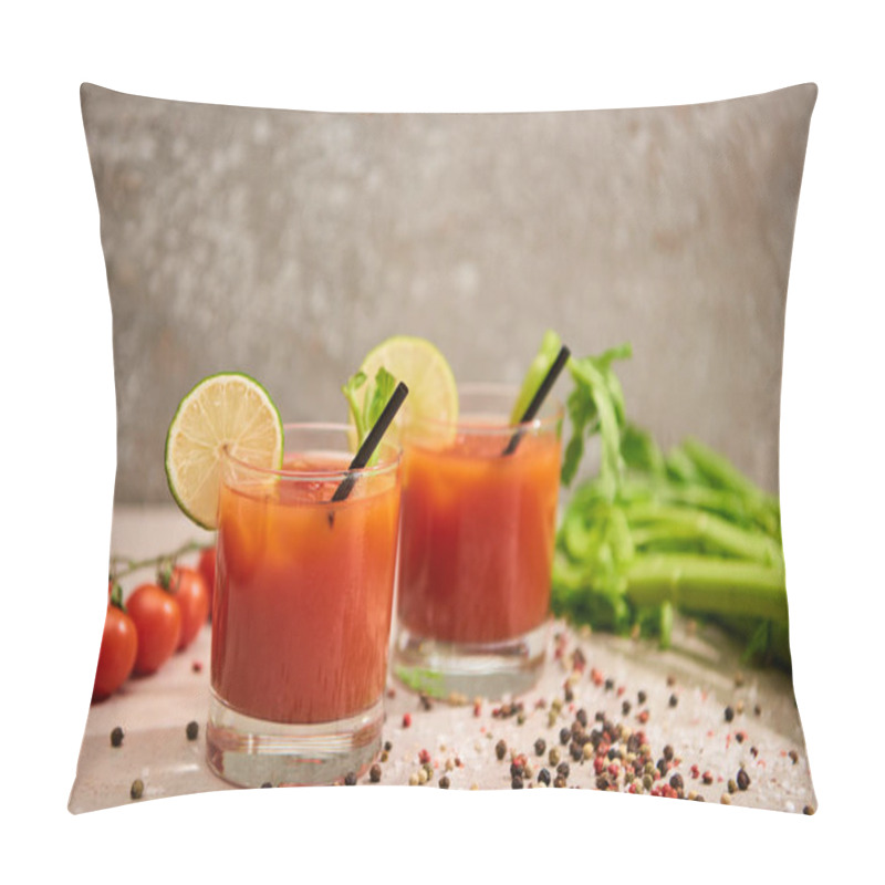 Personality  bloody mary cocktail in glasses with straws and lime near salt, pepper, tomatoes and celery on grey background pillow covers
