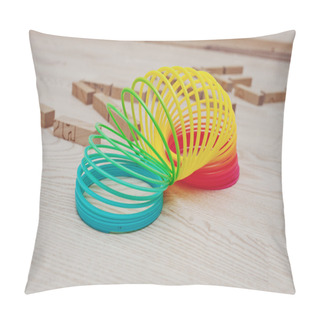 Personality  Rainbow Spiral Spring Game On Wooden Background Pillow Covers