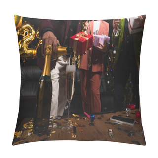 Personality  Cropped View Of Man Pouring Champagne Near Blurred Friends With Gifts And Confetti During New Year Party On Black Background  Pillow Covers