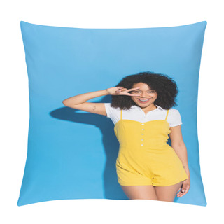 Personality  Joyful African American Woman Showing Victory Gesture Near Face On Blue Pillow Covers