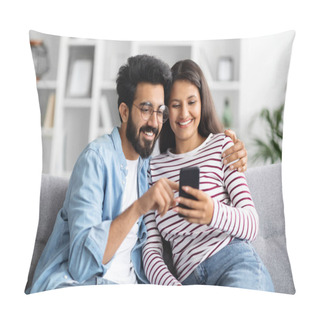 Personality  Relaxed Cheerful Beautiful Young Multicultural Couple Middle Eastern Guy And Indian Woman Sitting On Sofa At Home, Using Smartphone And Smiling, Shopping Online, Surfing On Internet, Copy Space Pillow Covers