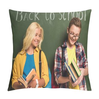 Personality  Smiling Schoolkids Holding Books And Standing Near Chalkboard With Back To School Lettering  Pillow Covers