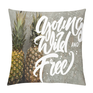Personality  Top View Of Ripe Pineapples On Grey Concrete Surface With Young, Wild And Free Illustration Pillow Covers