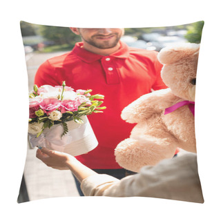 Personality  Selective Focus Of Happy Delivery Man Holding Teddy Bear And Flowers Near Girl Pillow Covers