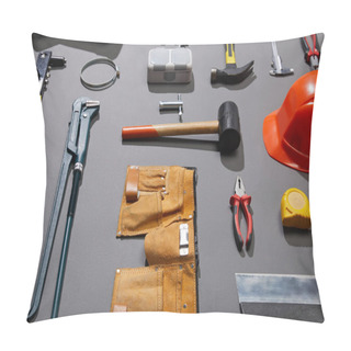 Personality  High Angle View Of Tool Belt, Helmet, Hammers, Monkey Wrench, Putty Knife, Pliers, Calipers, Rivet Gun And Measuring Tape On Grey Background Pillow Covers