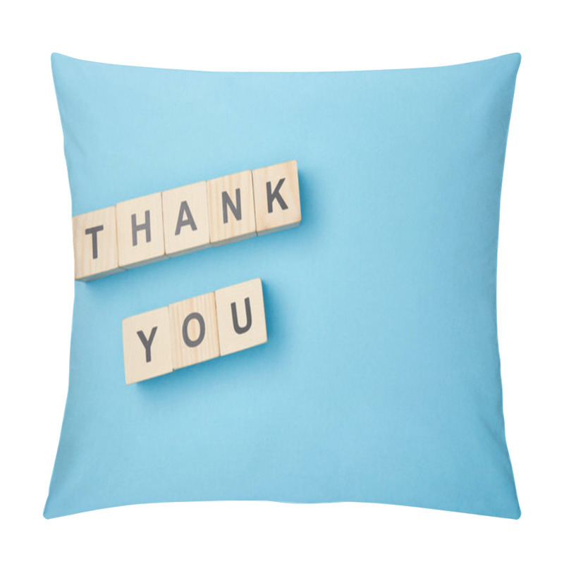 Personality  top view of wooden cubes with thank you words on blue background pillow covers