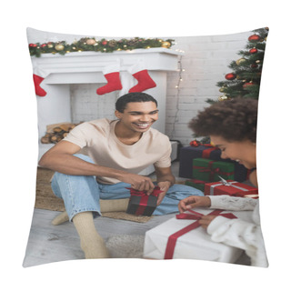 Personality  Smiling African American Man Looking At Girlfriend Opening Gift Box Near Christmas Tree Pillow Covers