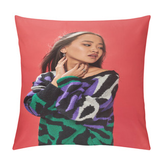 Personality  Beautiful Asian Woman In Sweater With Animal Print Touching Neck While Posing On Red Backdrop Pillow Covers