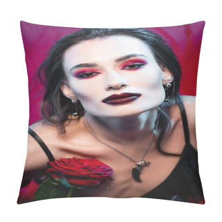 Personality  High Angle View Of Young Woman With Blood On Face Looking At Camera And Holding Rose On Red Pillow Covers